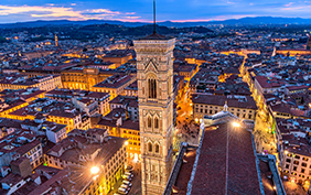 Giotto's Campanile - An aerial dusk view of Giotto's Campanile and the historical Old Town of Florence, as seen from the top of Brunelleschi's Dome of the Florence Cathedral. Florence, Tuscany, Italy.