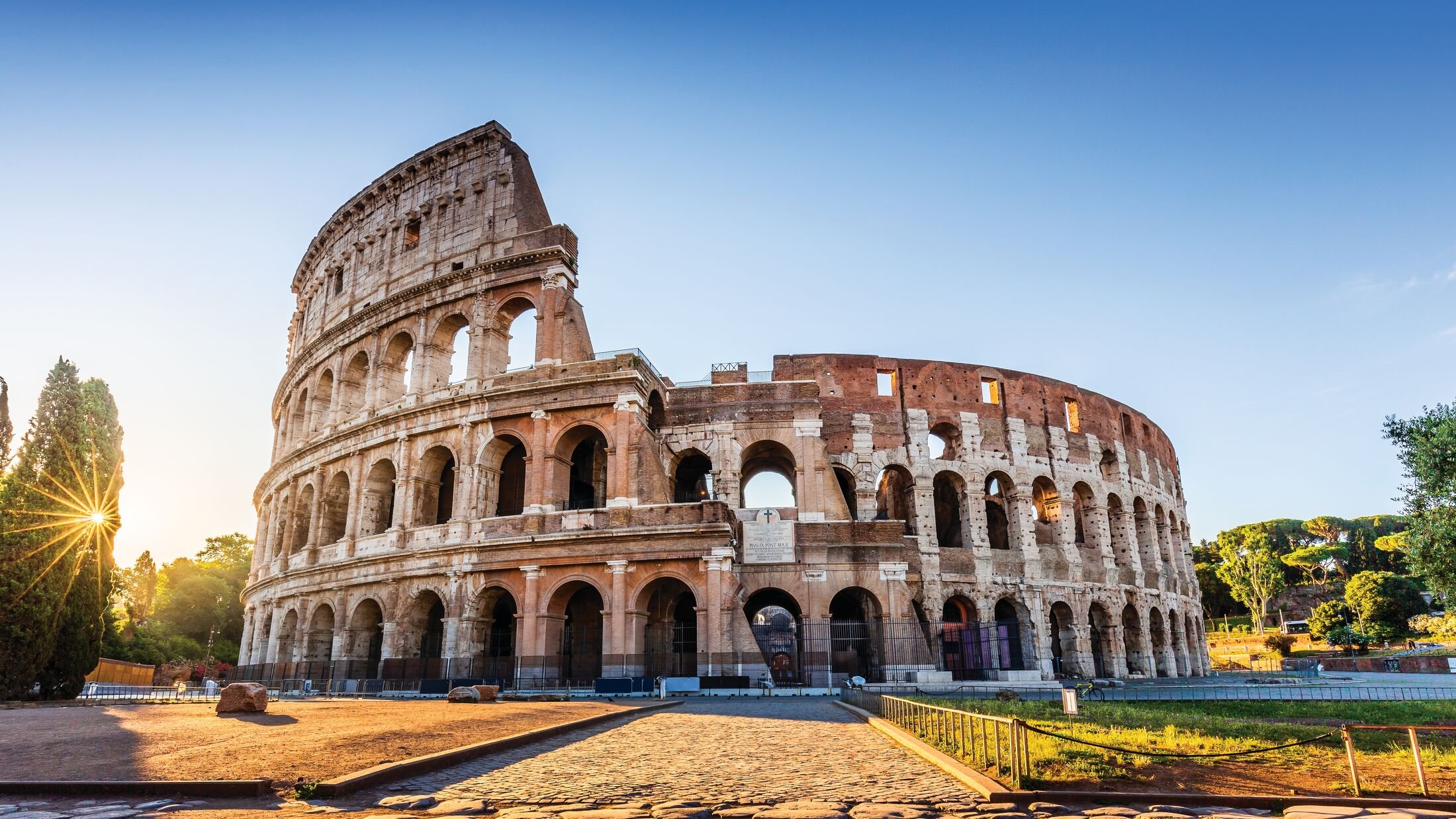 Rome, Italy. The Colosseum or Coliseum at sunrise.