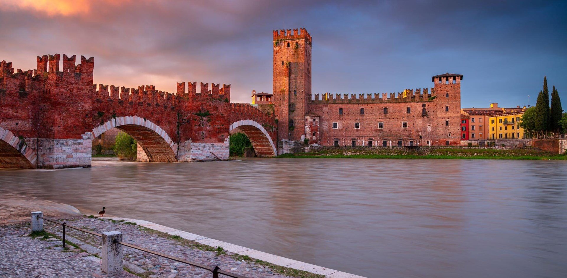 Verona, Italy. Cityscape image of beautiful Italian town Verona with the Castelvecchio Bridge over Adige River at sunrise.