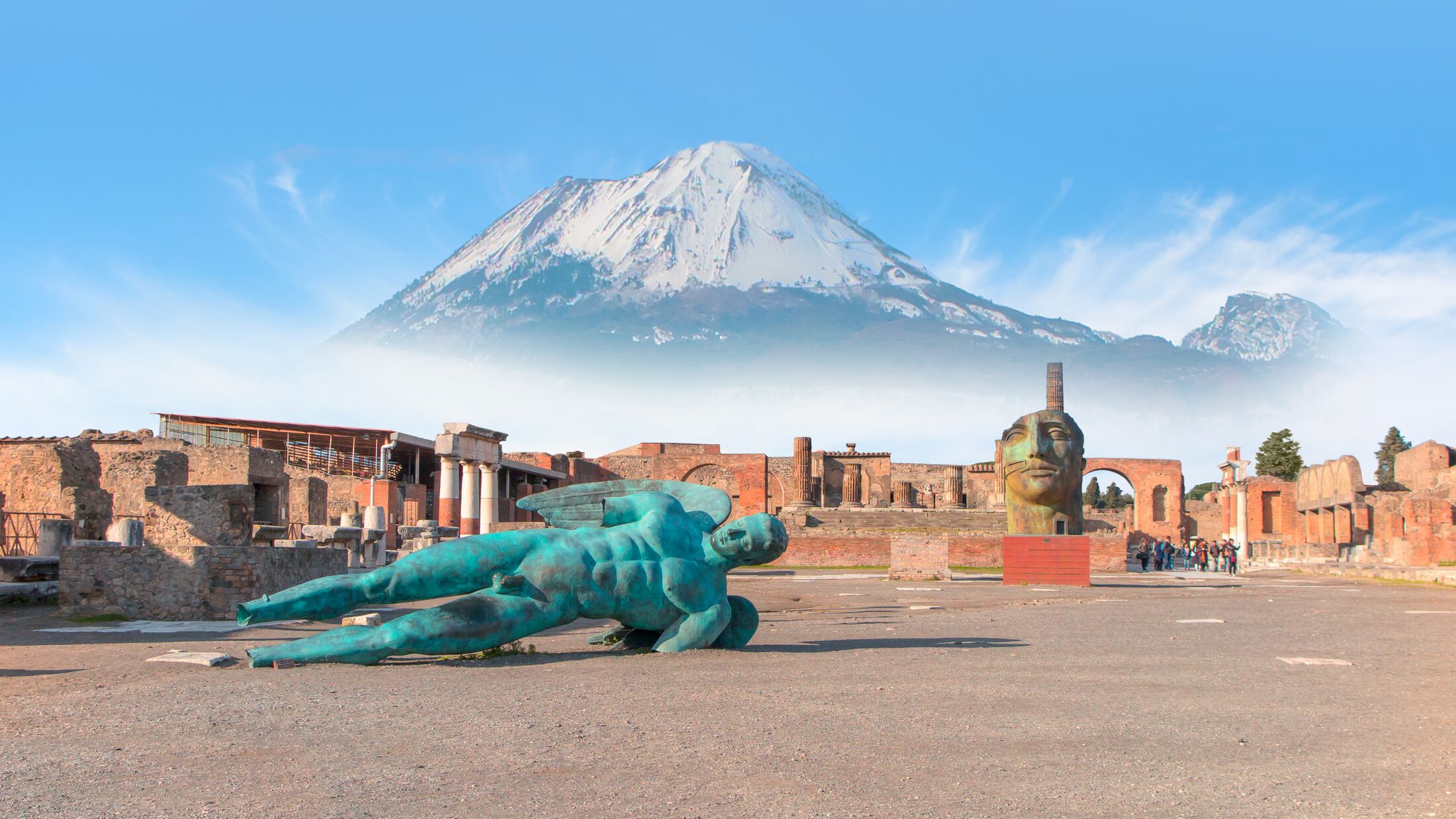 Ancient Roman city of Pompeii on the background Vesuvius volcano