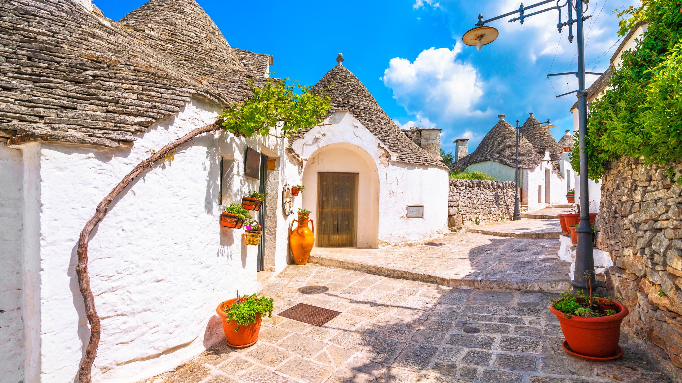 Trulli of Alberobello typical houses street view. Apulia, Italy. Europe.