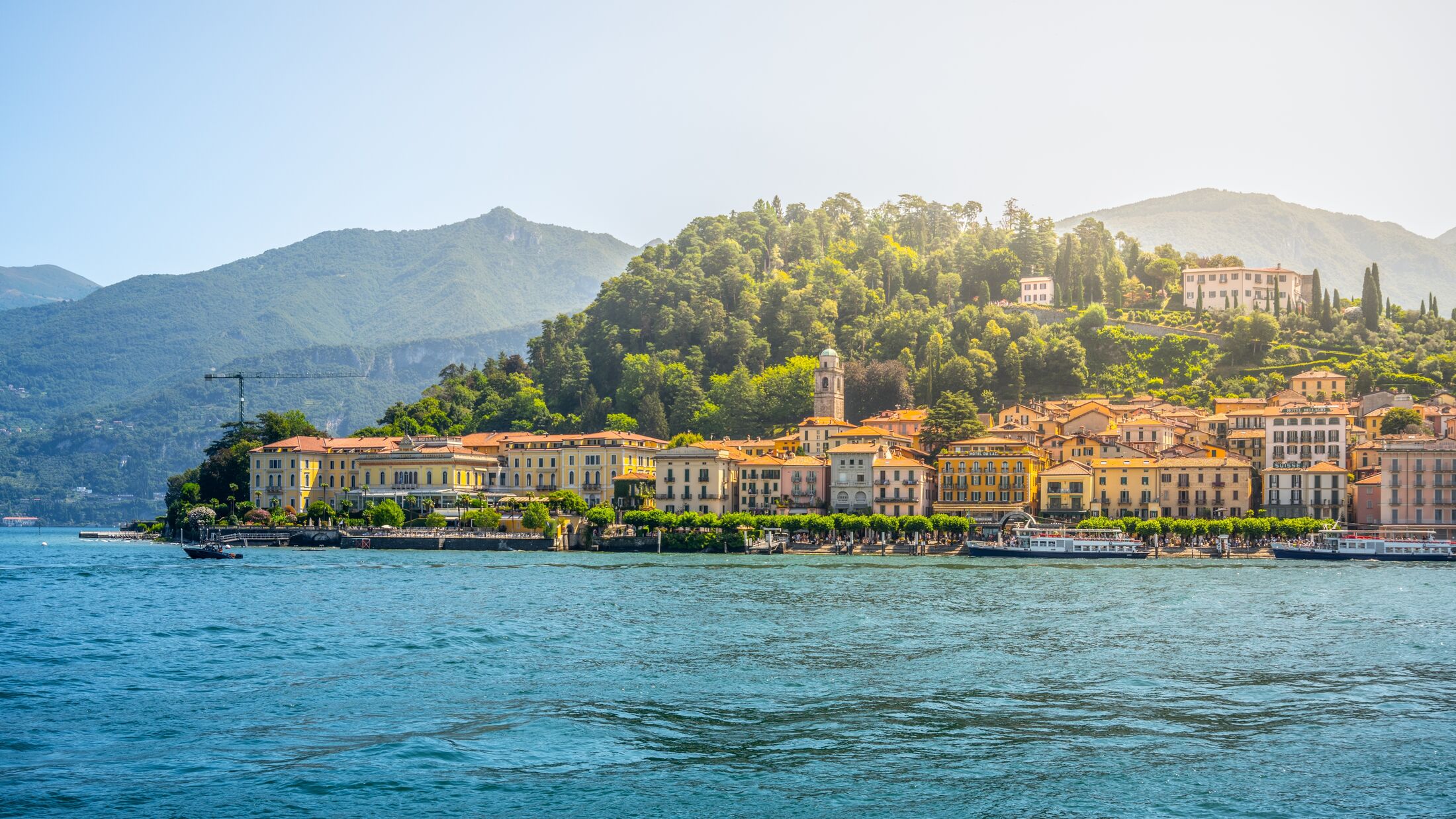 Bellagio town at Como Lake on sunny summer day. Idyllic view from ferry. Lombardy, Italy