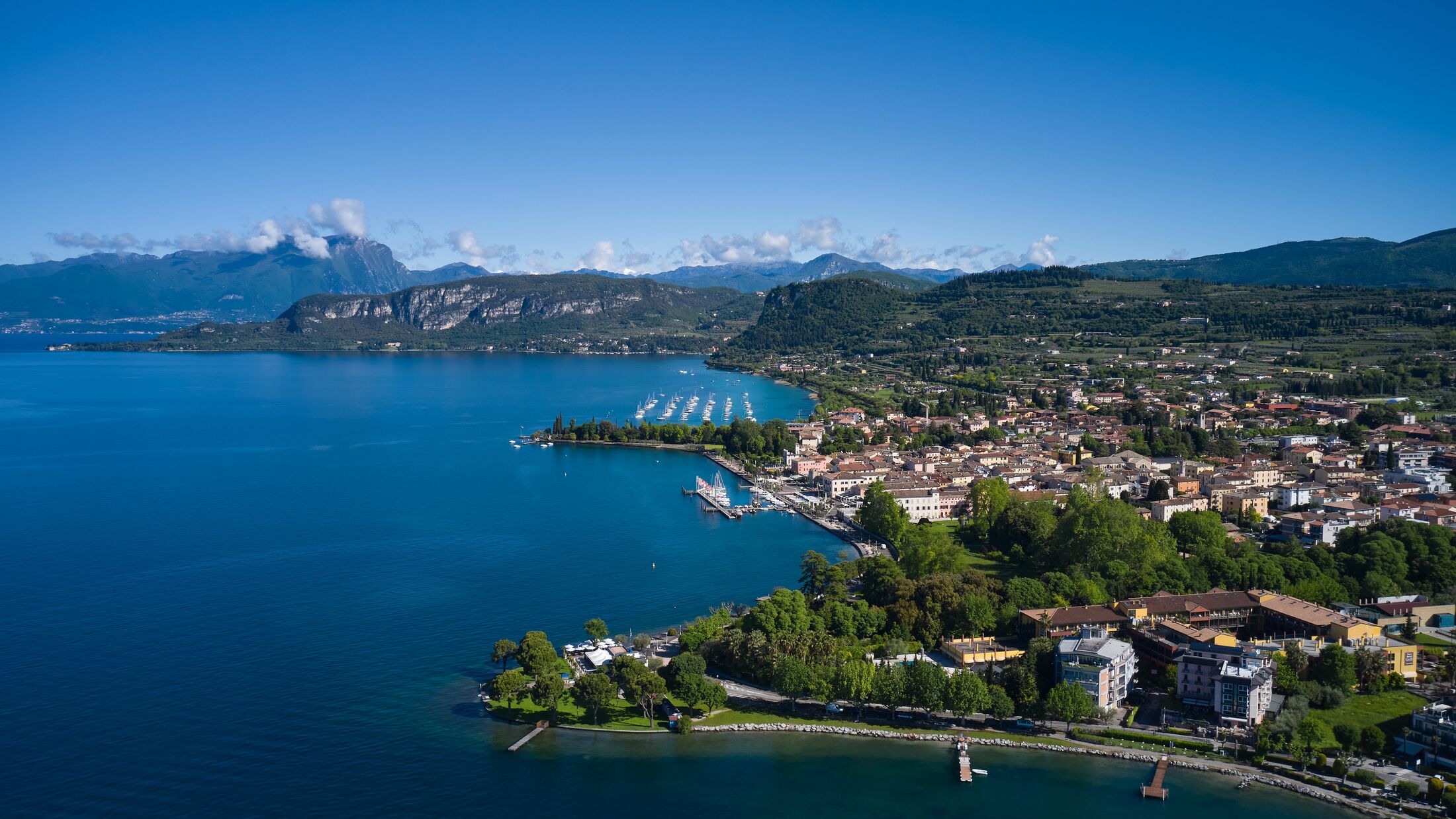 Aerial view of Bardolino, Lake Garda, Italy. Top view of the historic part of the city of Bardolino on the coastline of Lake Garda. Panorama of the historic town of Bardolino.