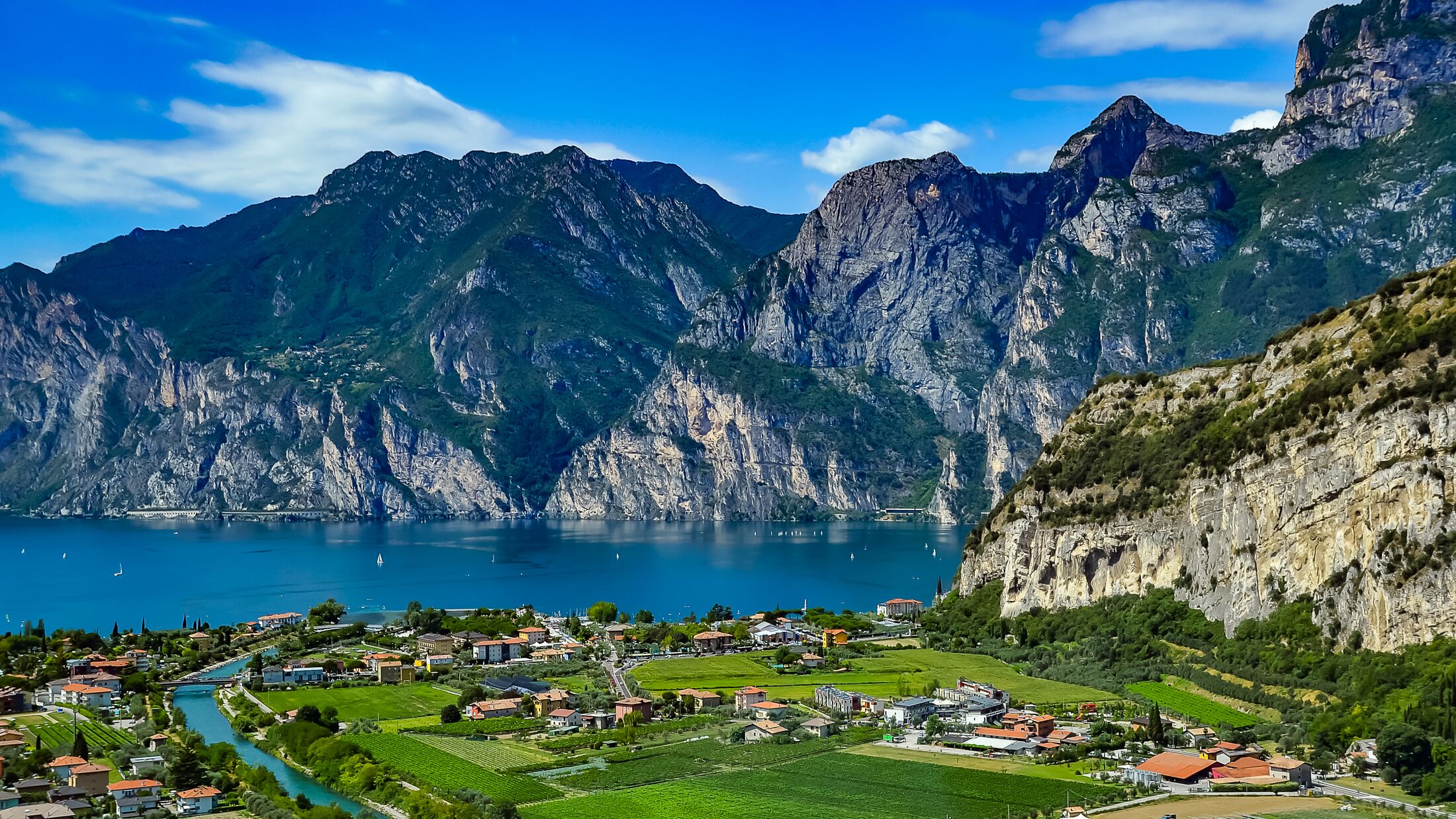 Panorama of the gorgeous Lake Garda surrounded by mountains in Riva del Garda, Italy. Lake Garda Italy