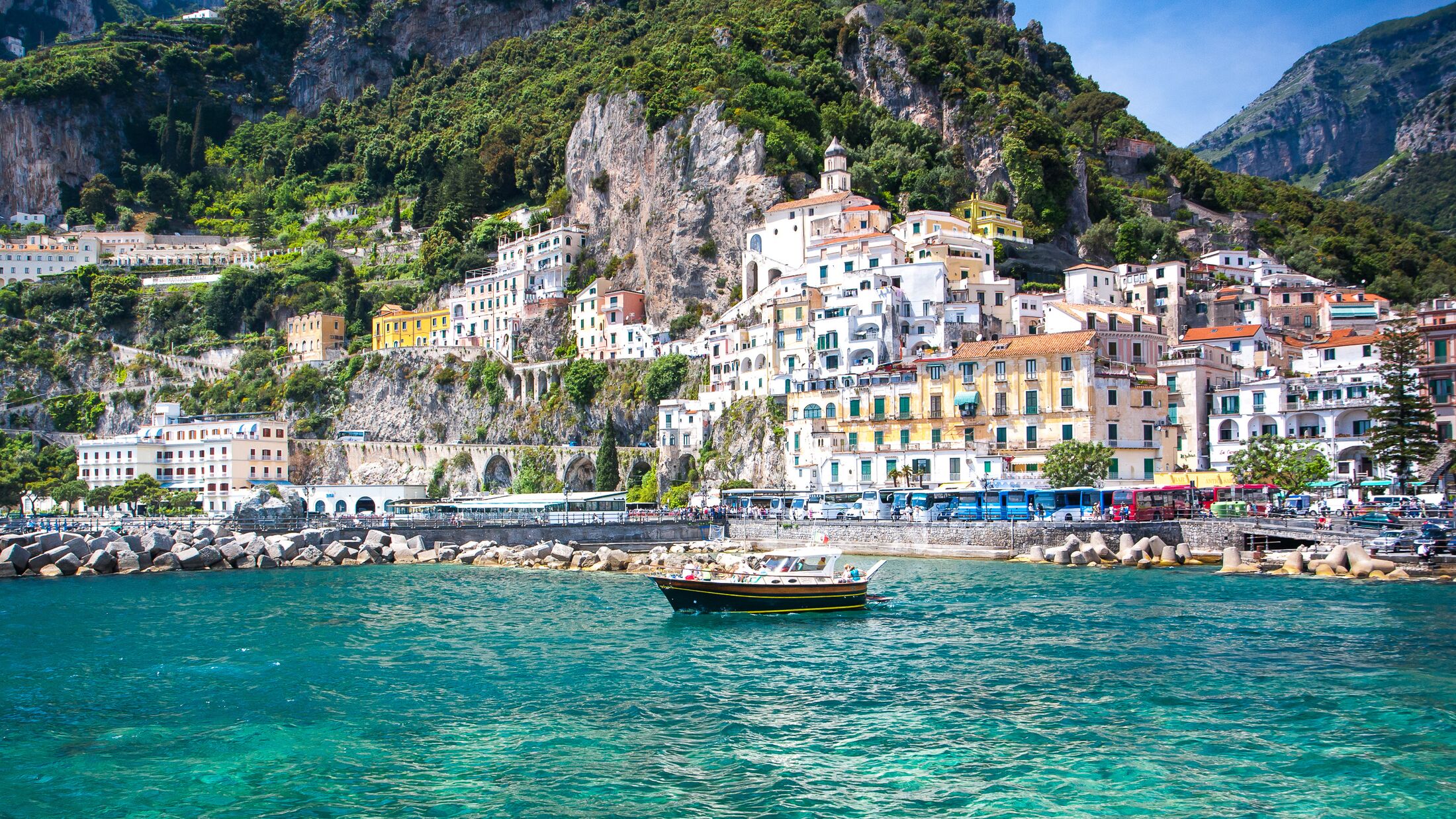 Colorful sunny Amalfi town landmark on Italy Positano coast.