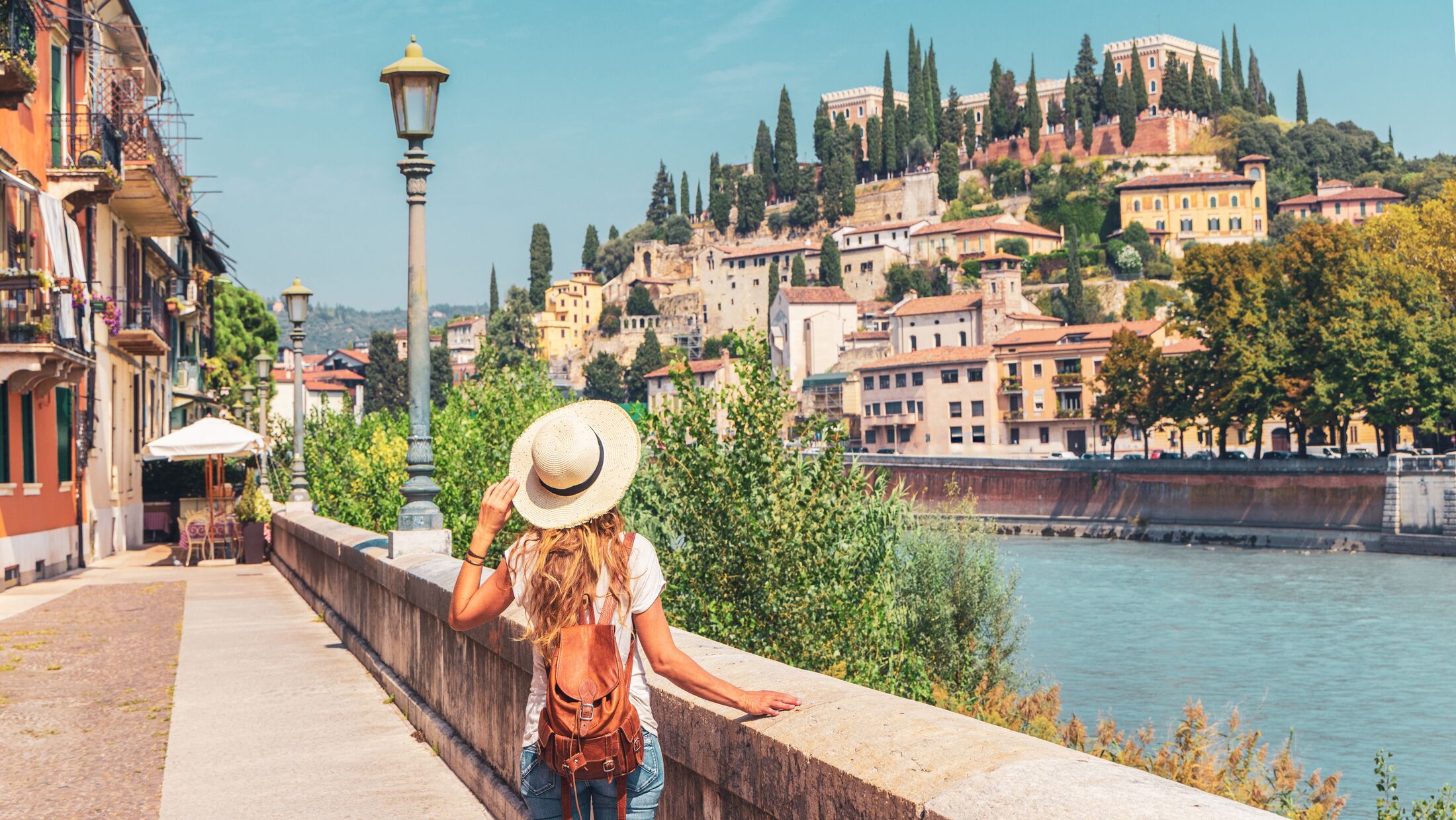 Verona, Italy- Traveler female looking at city landscape view