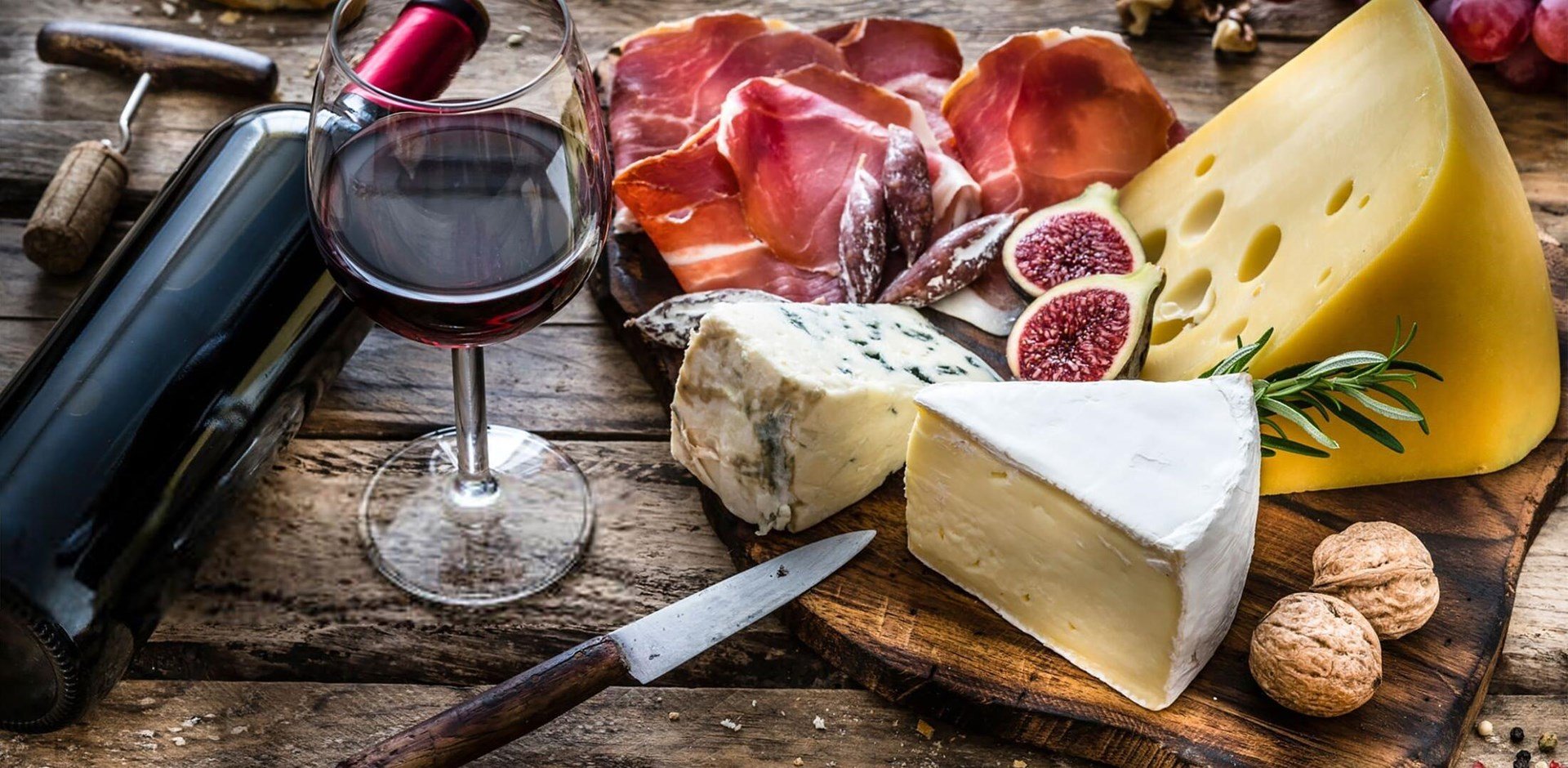 Wine Cheese Meat on rustic wooden table