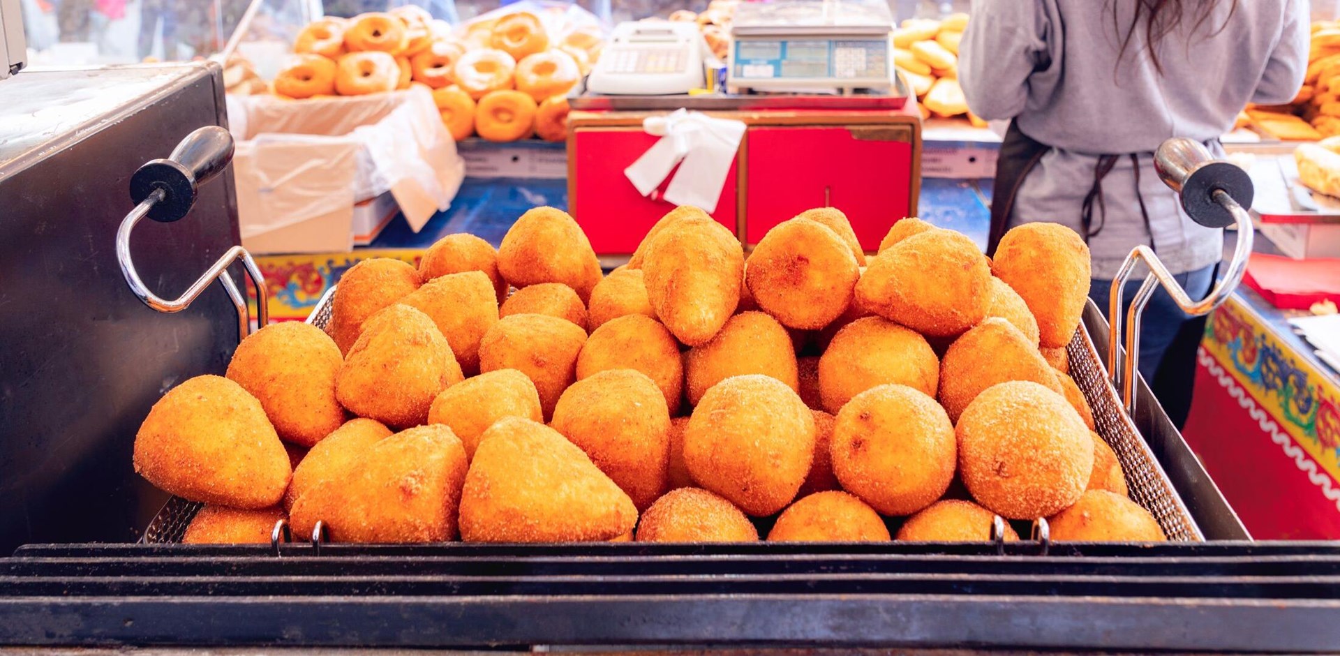 Sicilian arancini (Italian rice balls) Traditional street food in Italy.